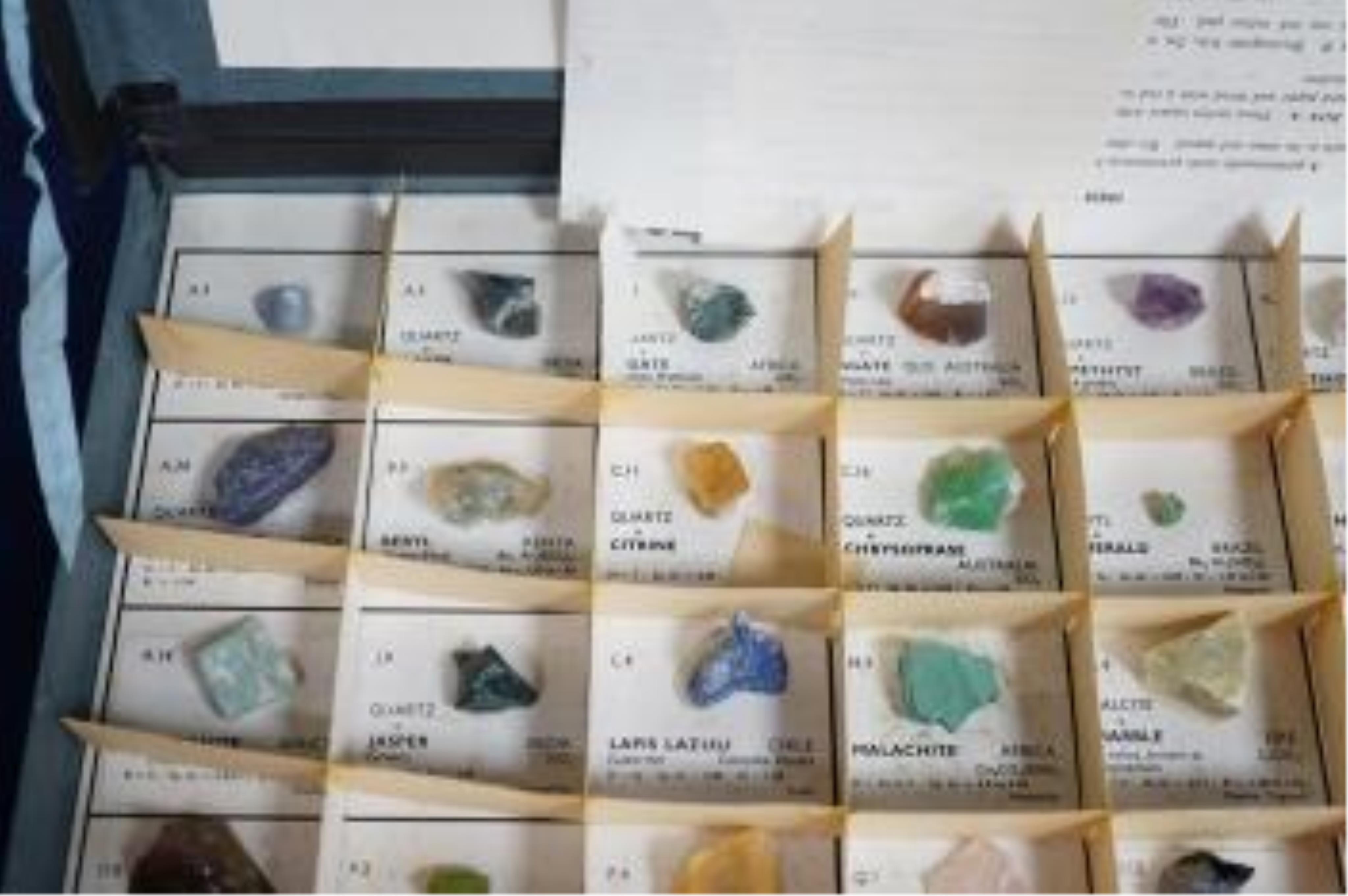 Three boxes containing unmounted cut gemstones including topaz, citrine, peridot, zircon, moonstone, etc. Condition - fair